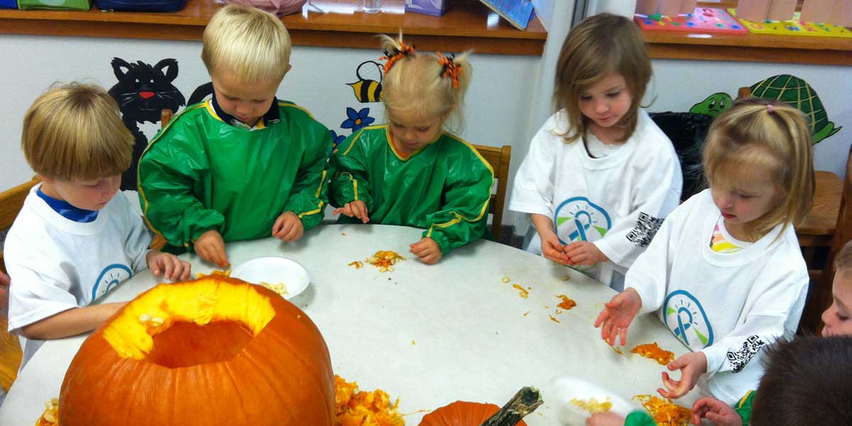 Children from Zion's weekday ministries carving a pumpkin